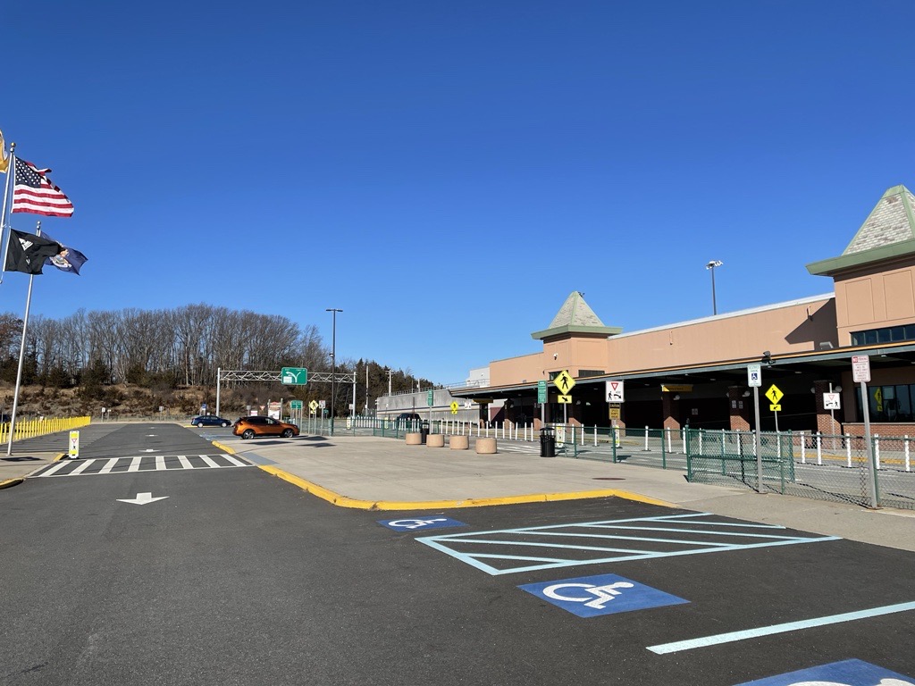 Stewart International Airport terminal image from the outside. Included in the image are accessible parking spaces located immediately across from the Terminal entrance